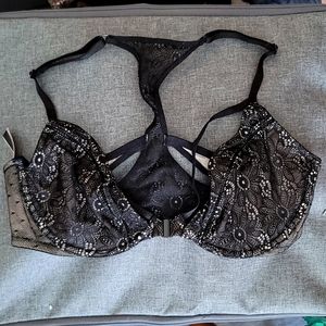 34D unpadded black bra. Front clasp